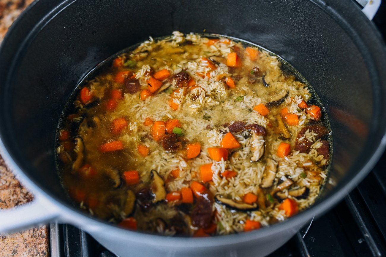 rice, vegetables, and liquid in dutch oven