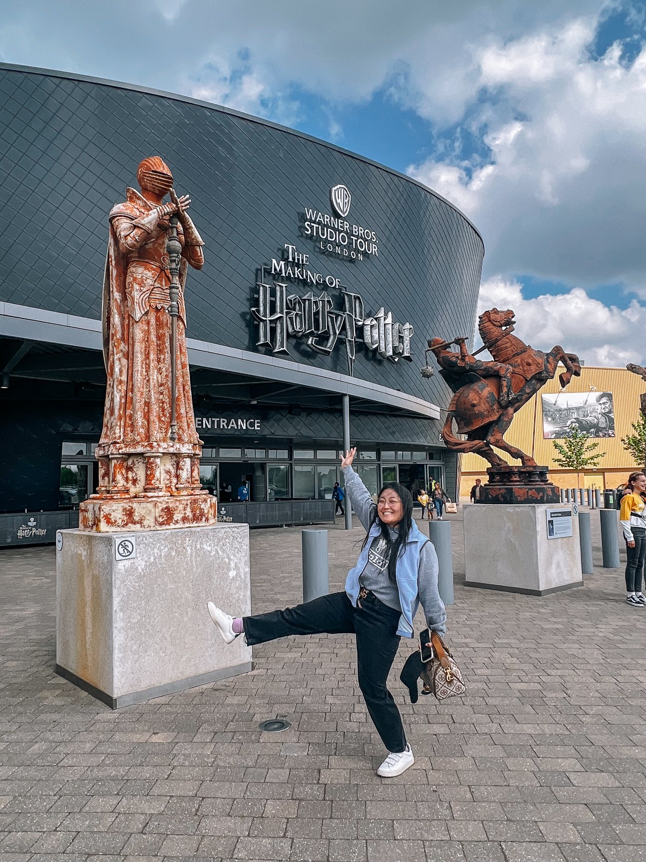 Kaitlin posing outside the Warner Brothers Harry Potter Studio Tour