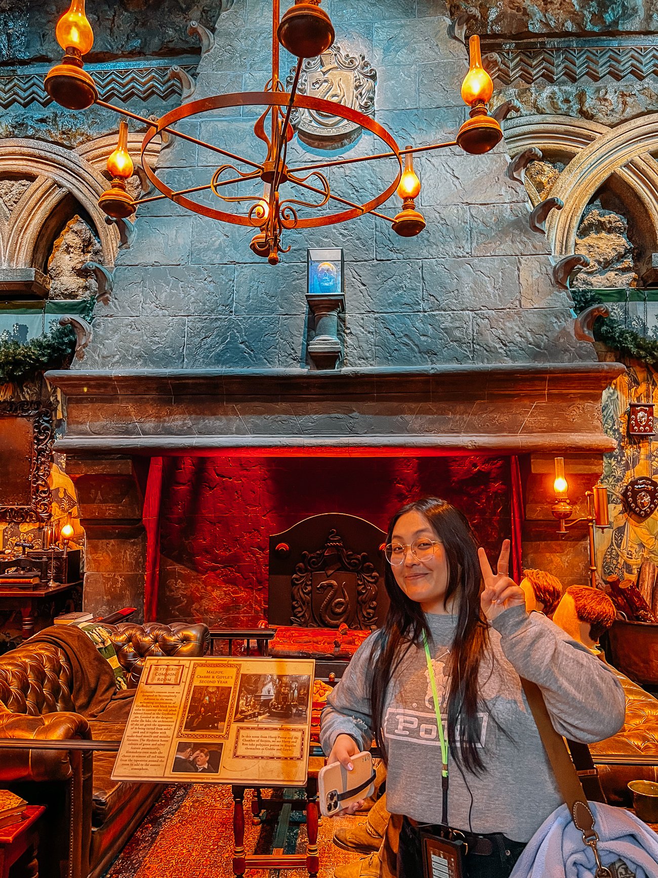 Kaitlin in front of the Slytherin common room at Harry Potter studio tour