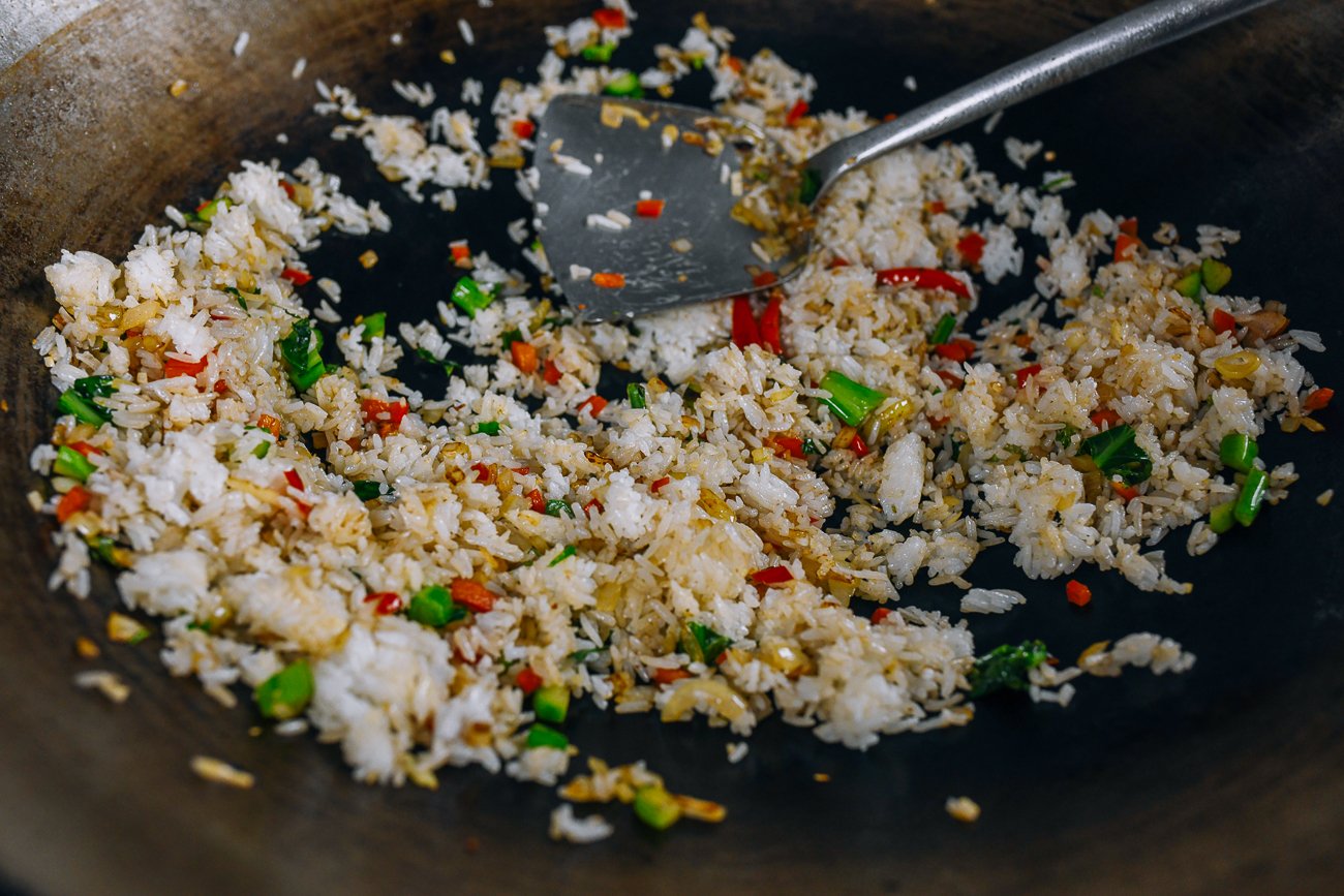 making thai fried rice in wok