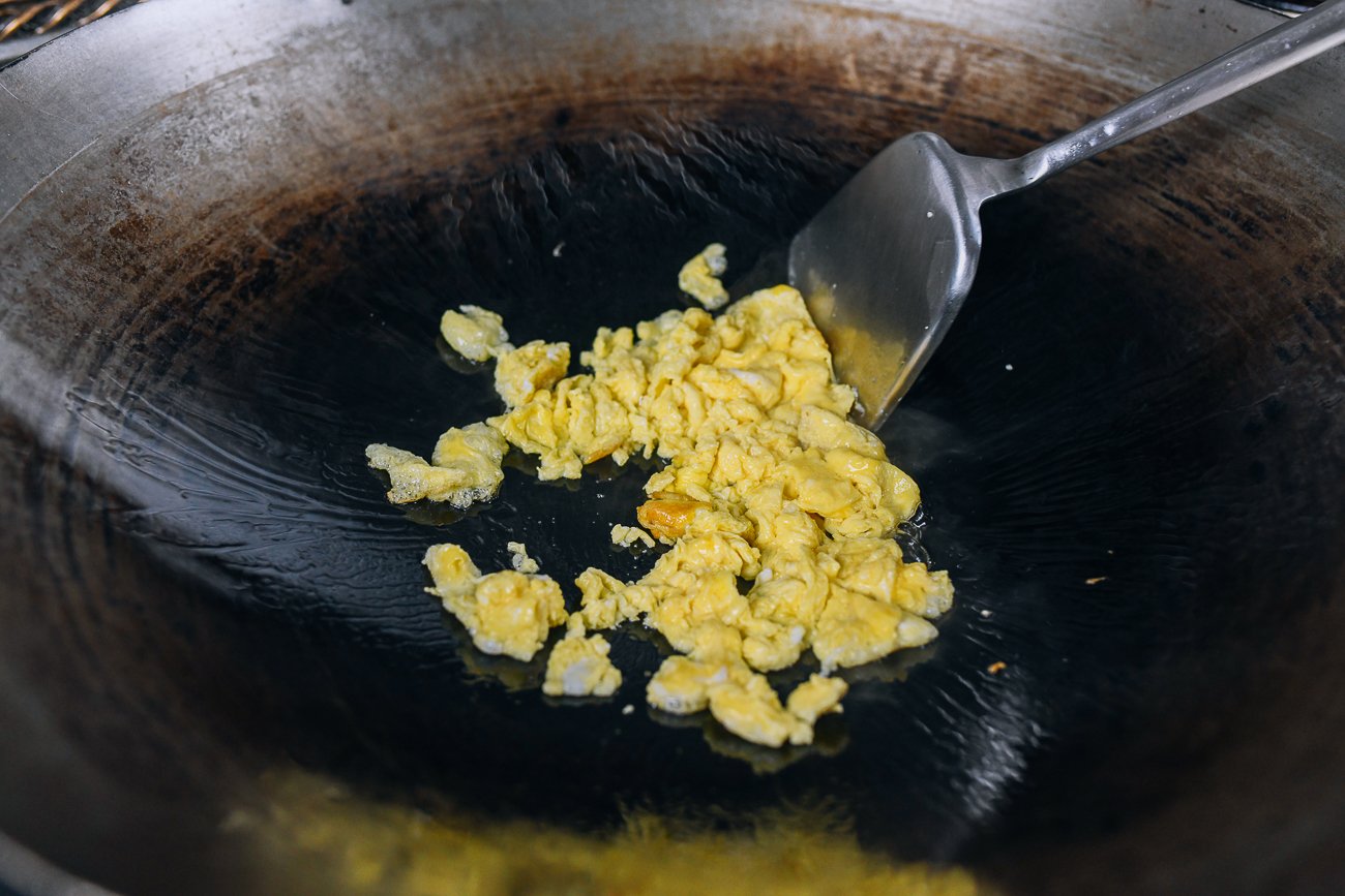 scrambling eggs in wok
