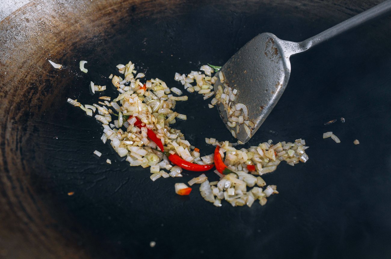 Diced onion and thai chilies in wok