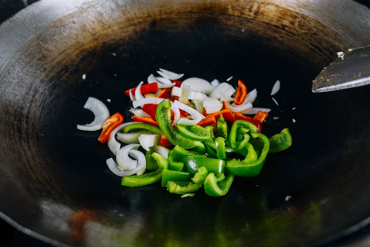 bell peppers and onions in wok