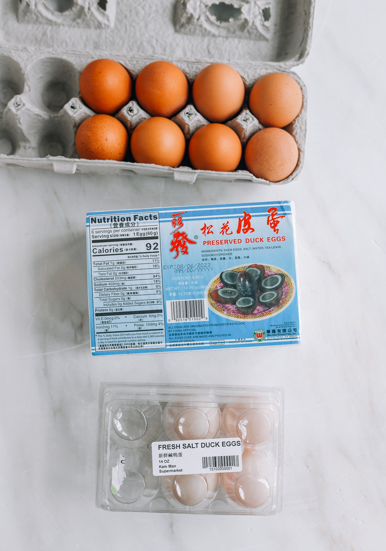 regular eggs, century eggs, and salted duck eggs in cartons