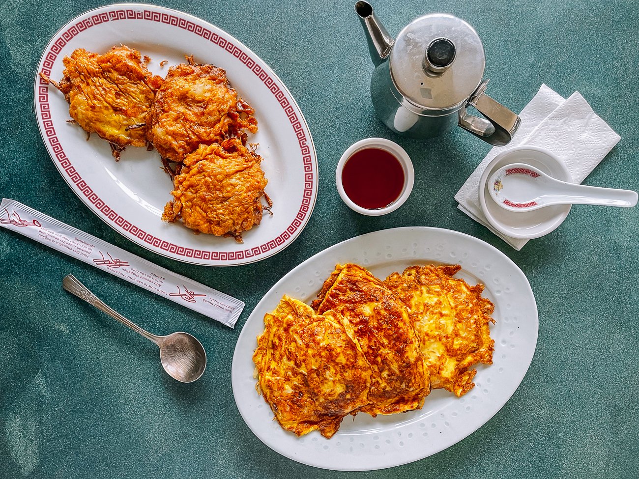 deep-fried and pan-fried egg foo young patties side by side