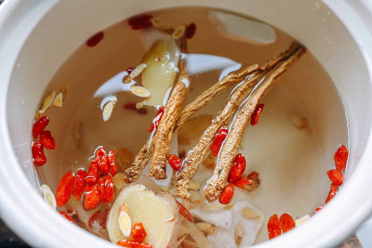 Chinese herbal soup ingredients in soup pot with water