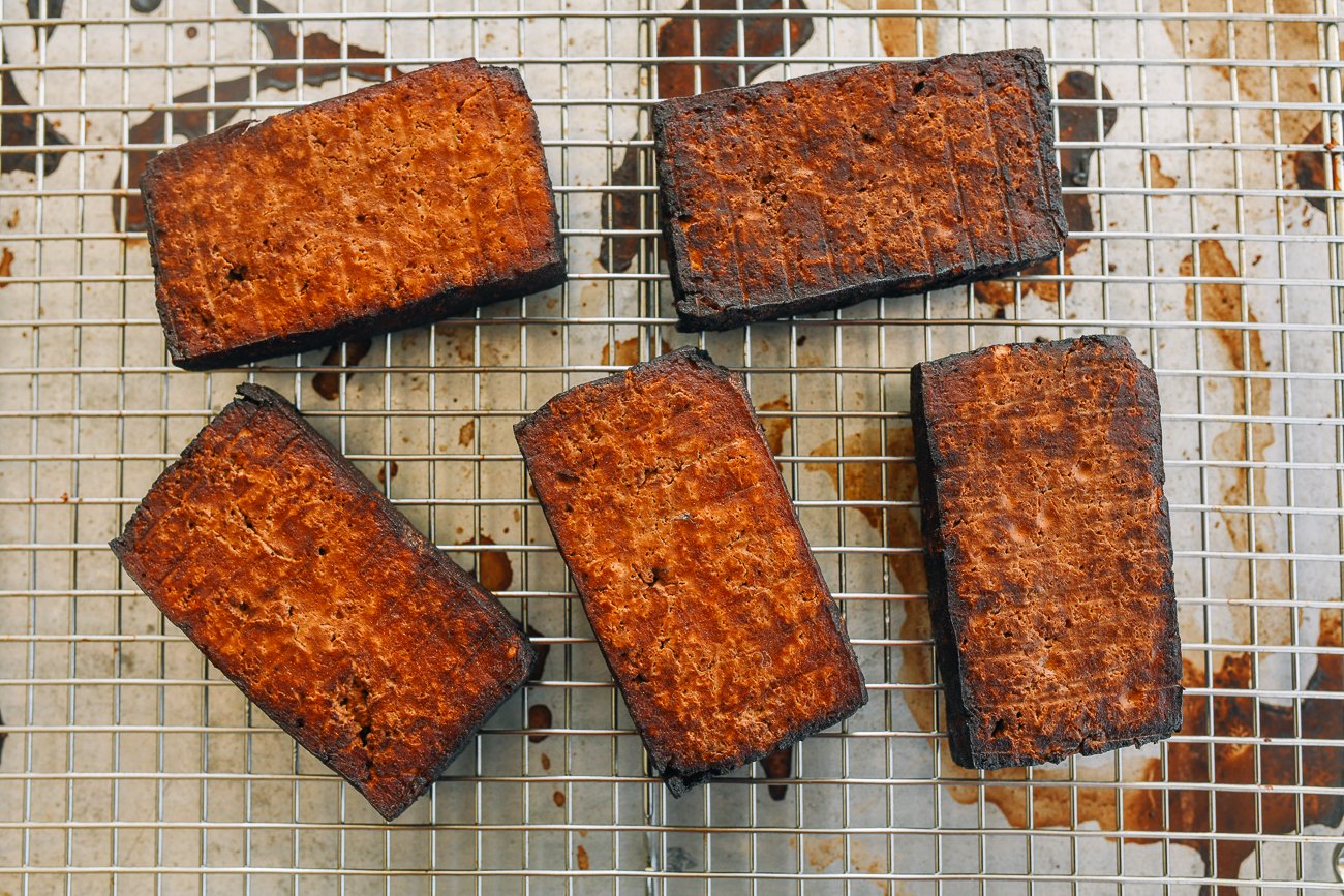pressed firm tofu that has been braised and then baked