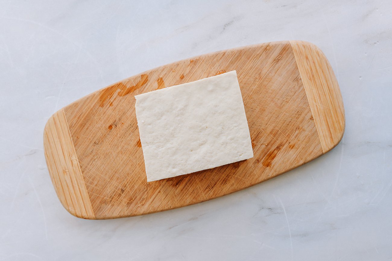 block of tofu on cutting board