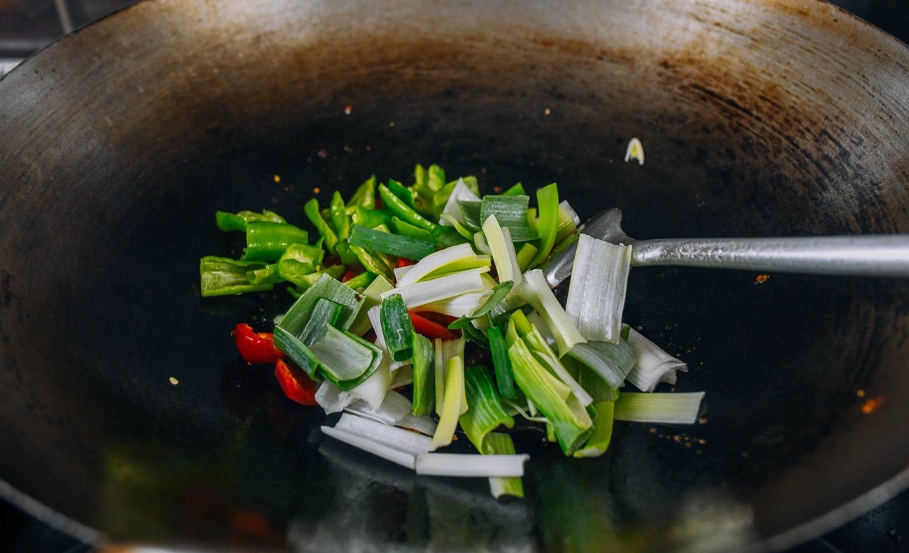 leeks in wok with aromatics