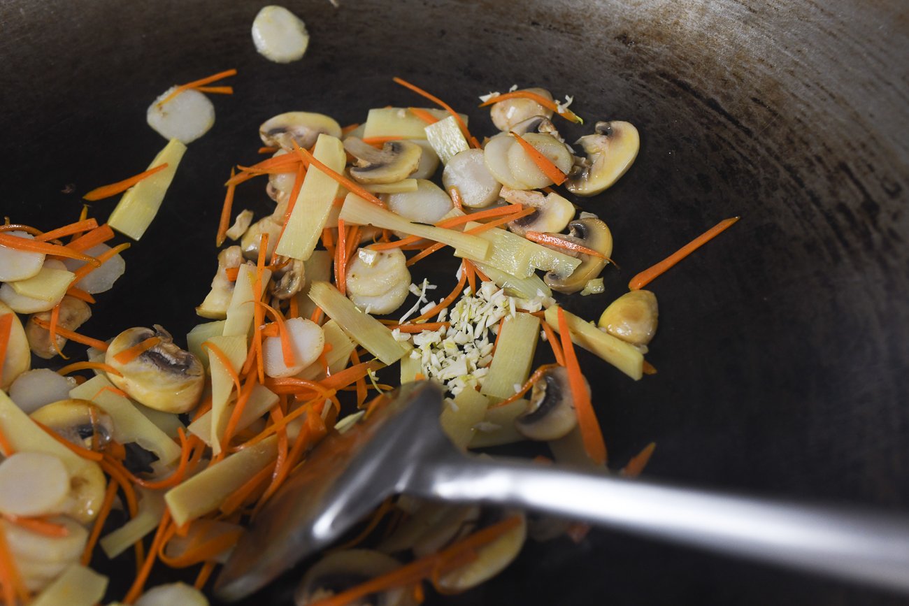 carrot, mushrooms, bamboo shoots, water chestnuts in wok