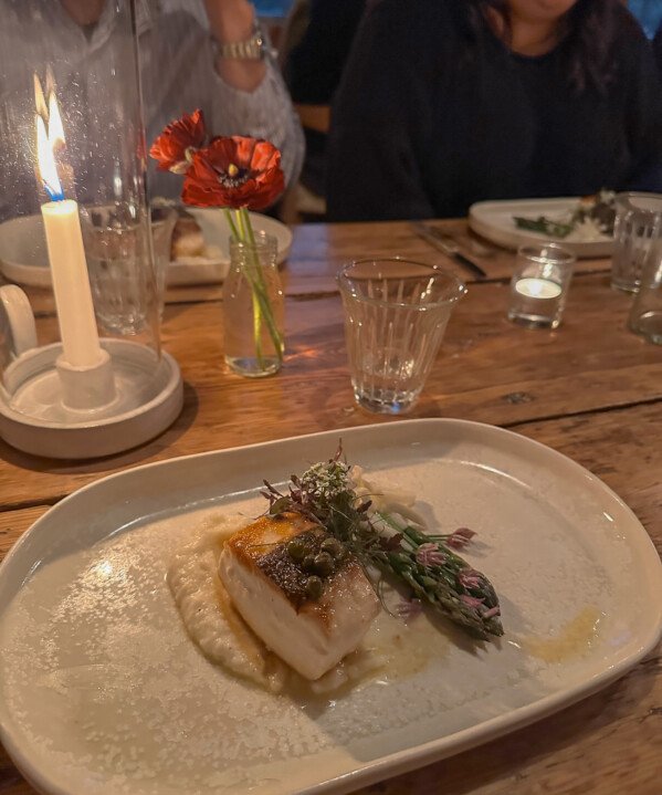 Seared halibut with polenta, capers, and asparagus at The Lost Kitchen