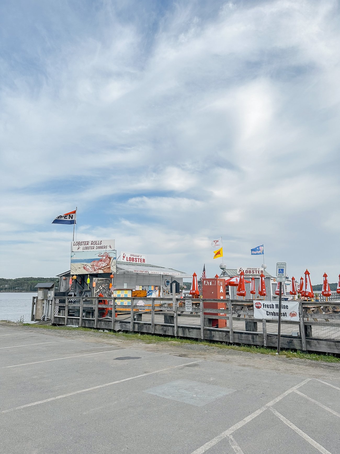 Sprague's Lobster in Wiscasset on the water with flags waving in the wind
