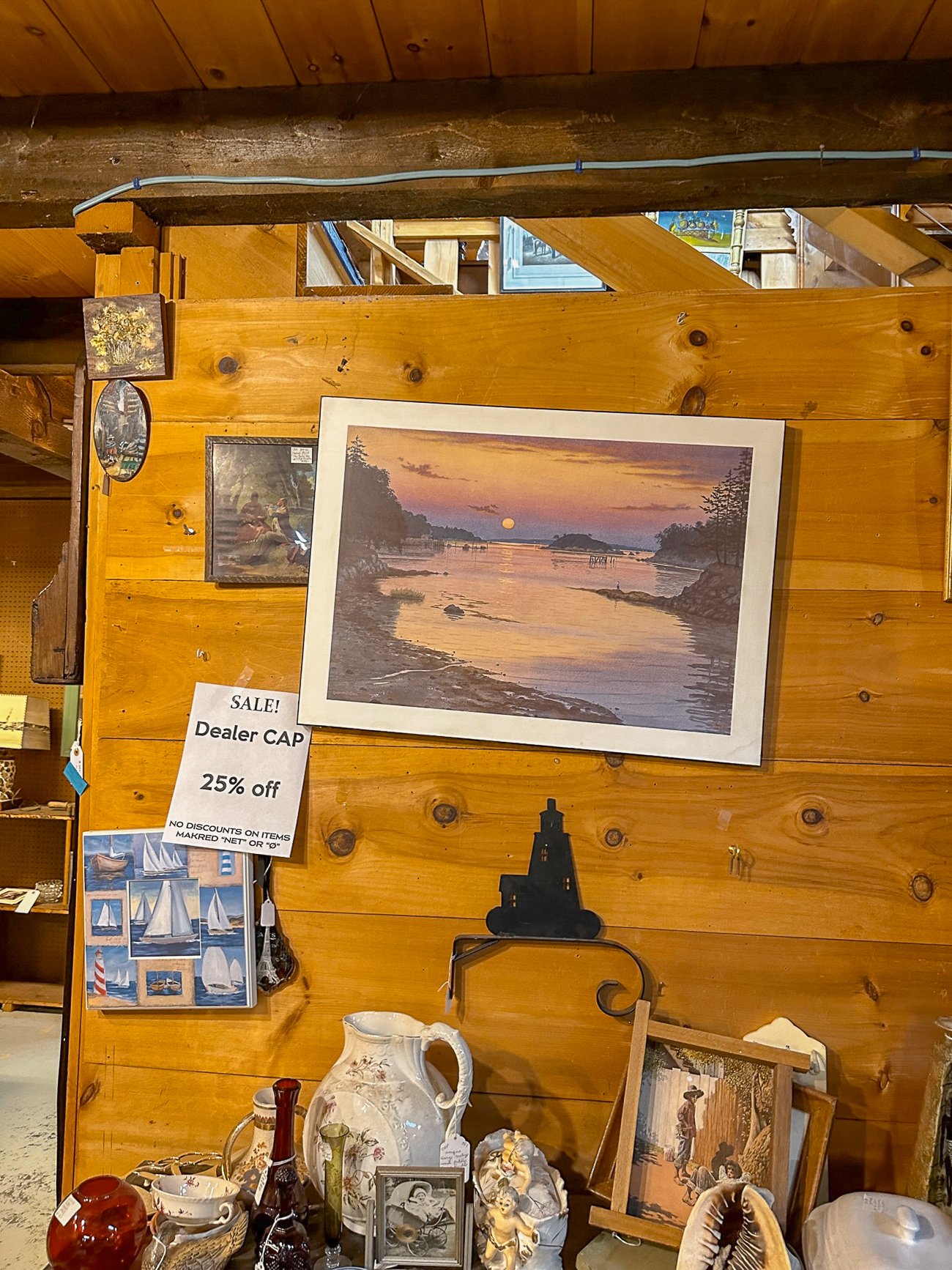 Painting of a Maine inlet at sunset in an antique store at the Wiscasset Antique Mall
