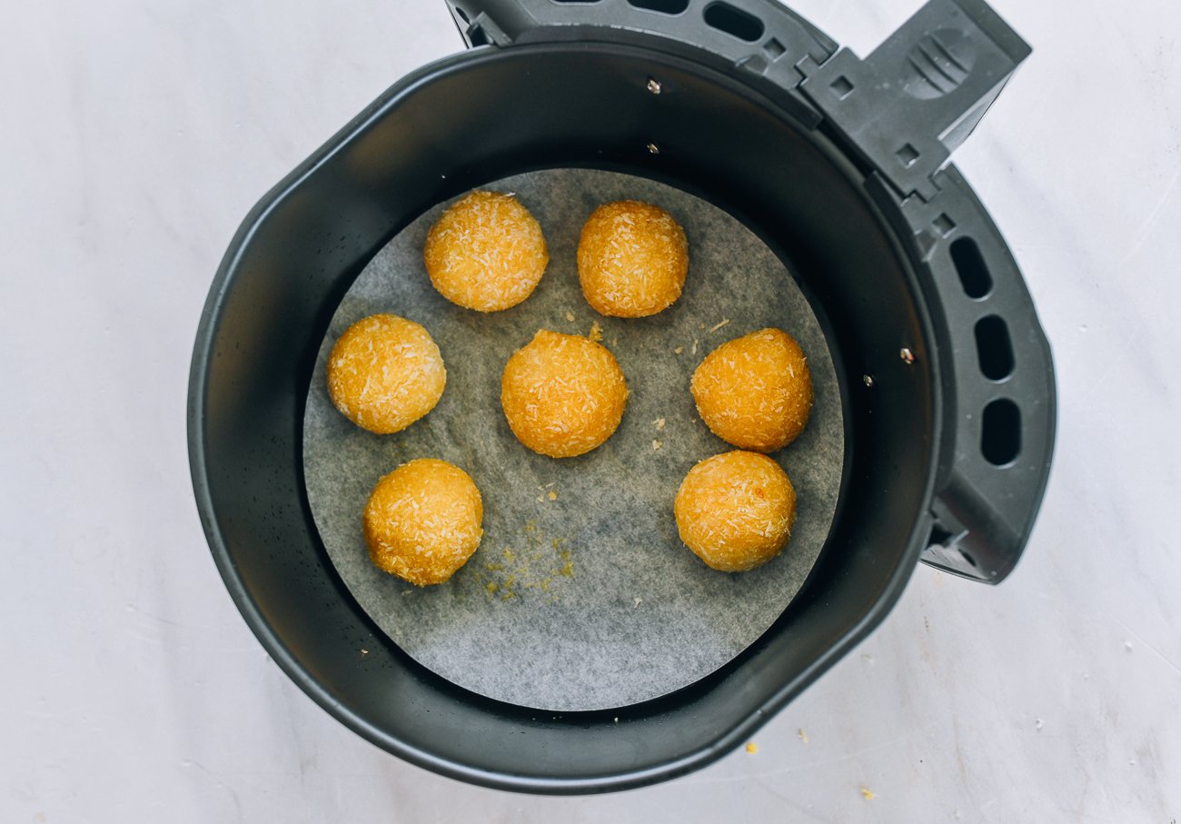 coated tang yuan arranged in air fryer tray