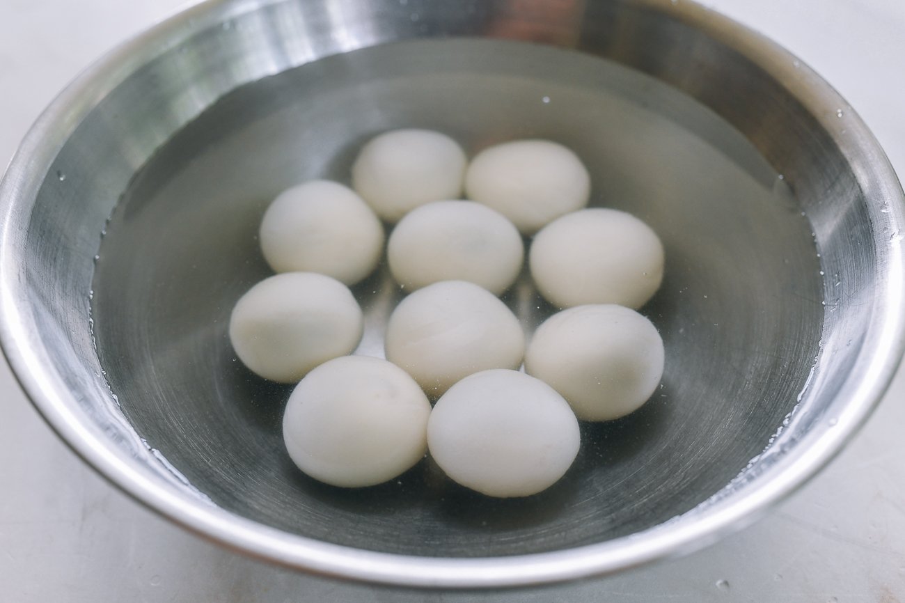 boiled tang yuan cooling in a bowl of water