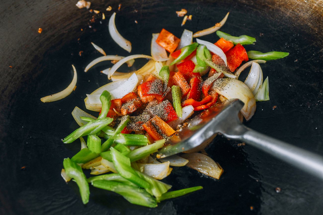 peppers, celery, and onion in wok