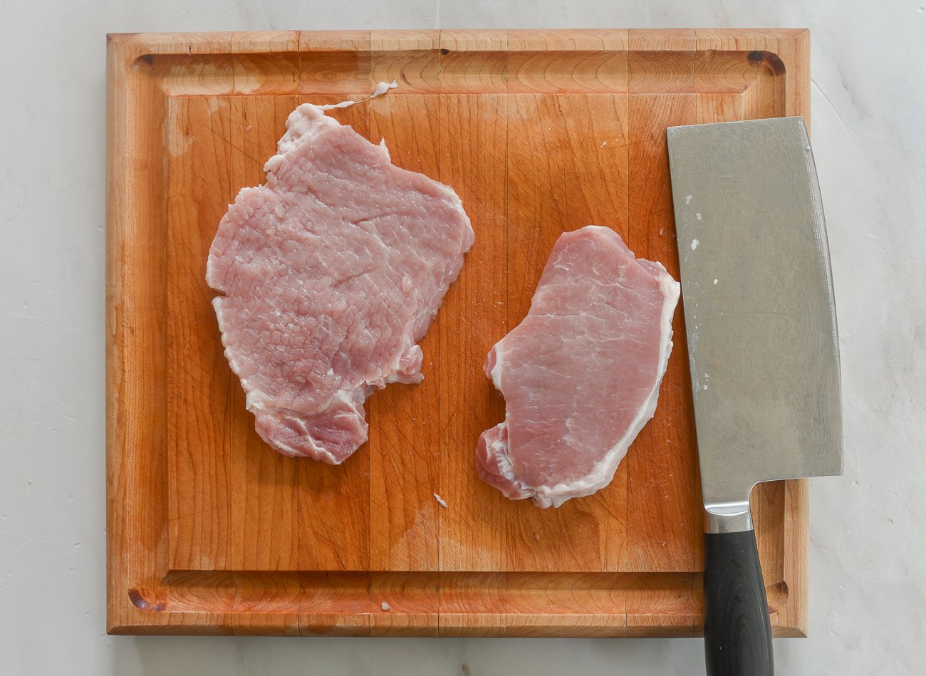 center cut pork chops on cutting board
