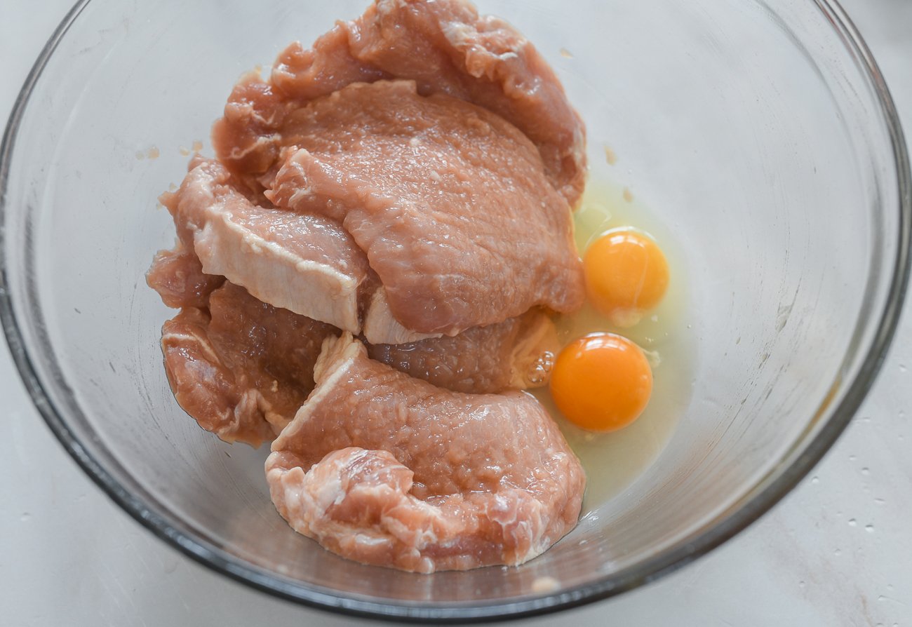 adding eggs to pork chops