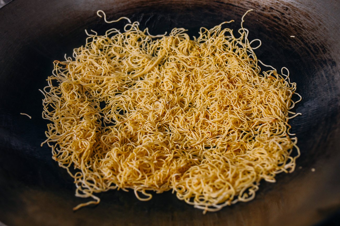 pan-frying noodles in wok