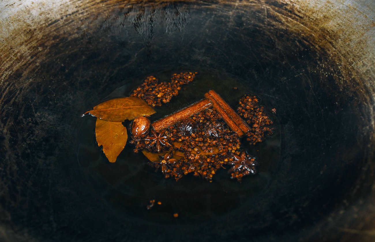 toasted Chinese spices in oil in wok