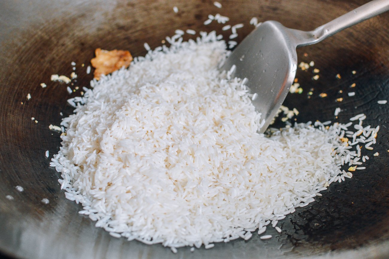 uncooked jasmine rice in wok
