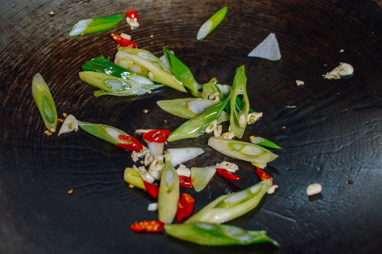 scallions, garlic, and chilies in wok