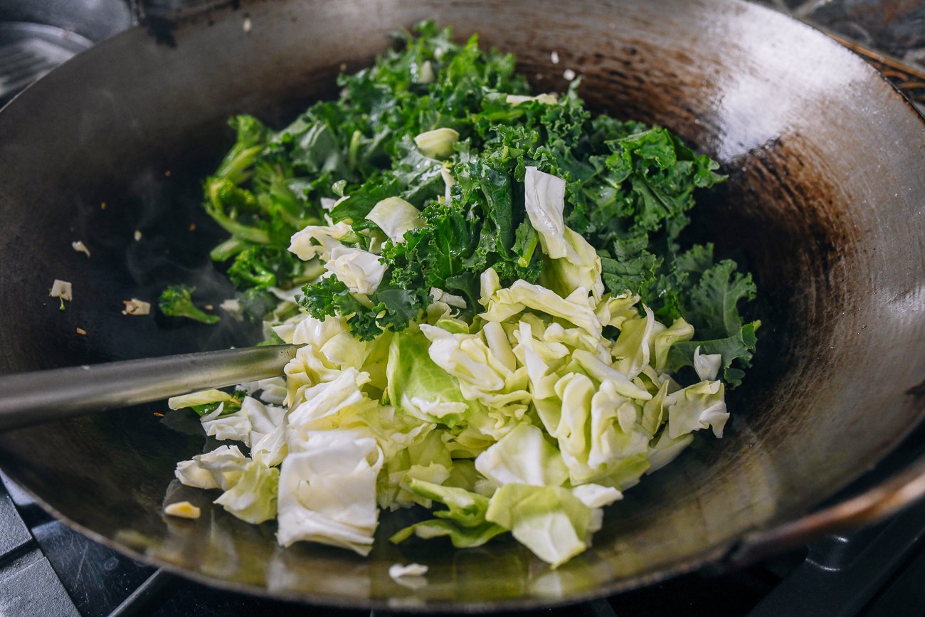 kale, cabbage, and broccoli in wok