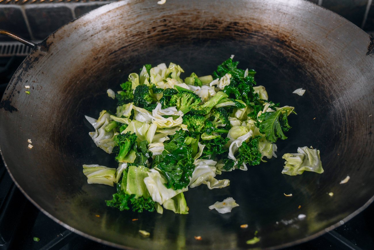 kale, cabbage, and broccoli in wok