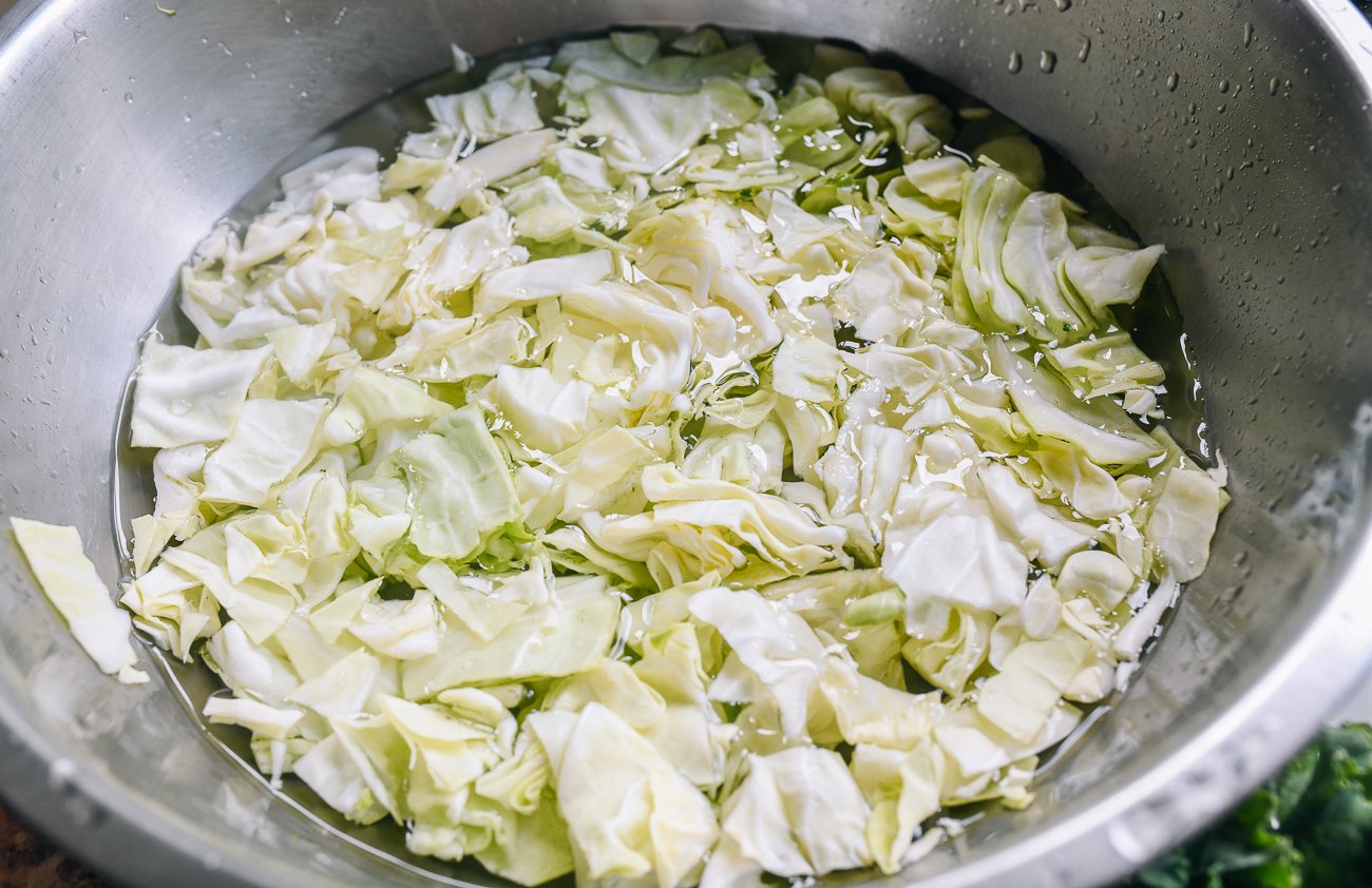 washing cabbage in bowl