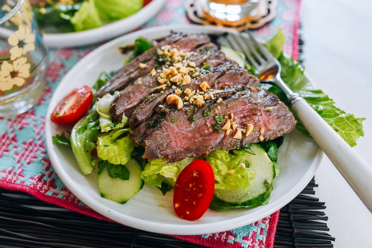 Plate of Thai Beef Salad with chopped peanuts