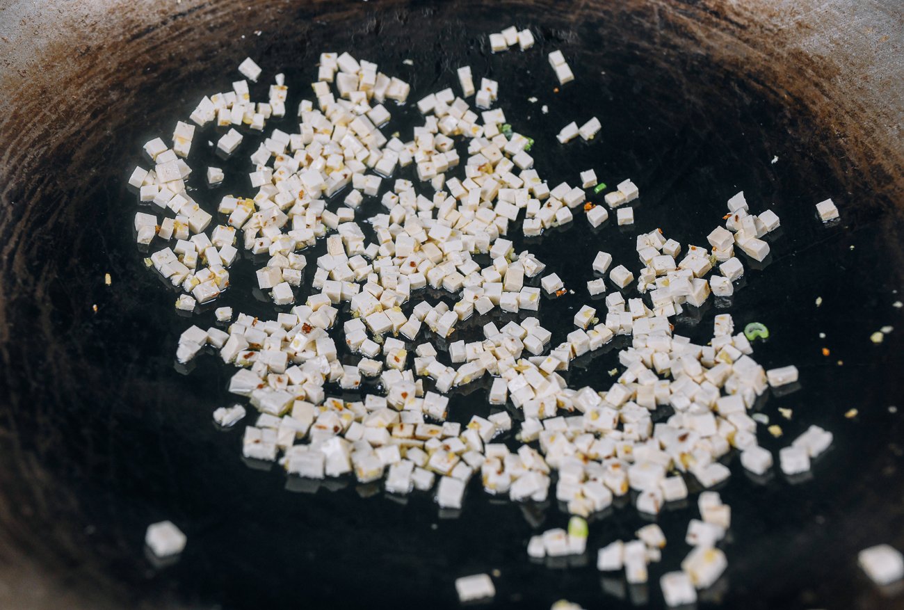 finely diced tofu in wok