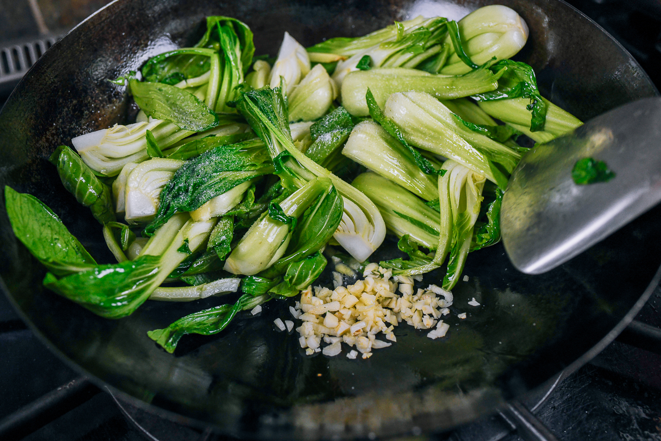 shanghai bok choy in wok with garlic