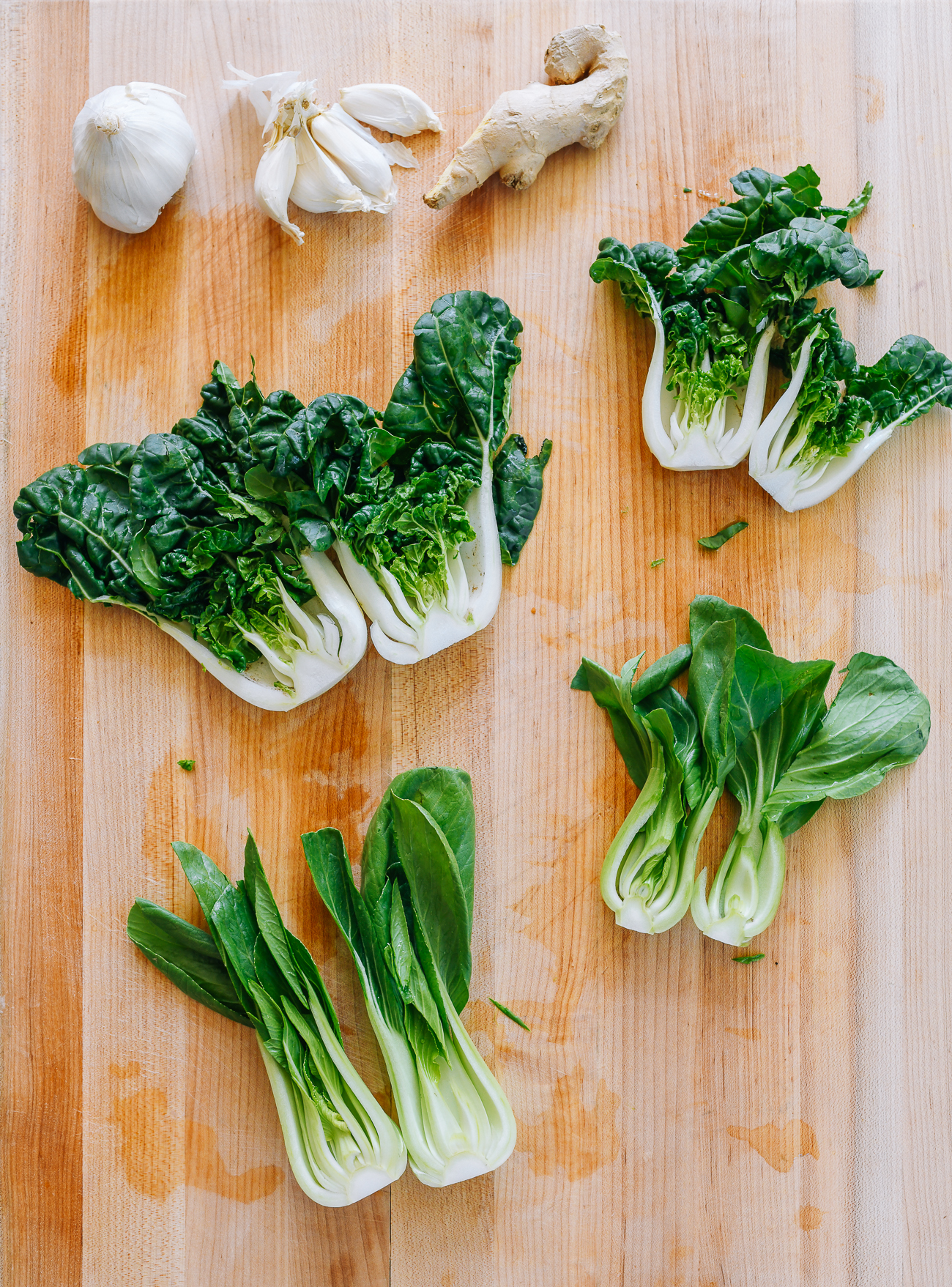 different types of bok choy on cutting board