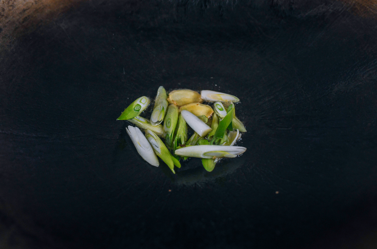 scallions and ginger in wok