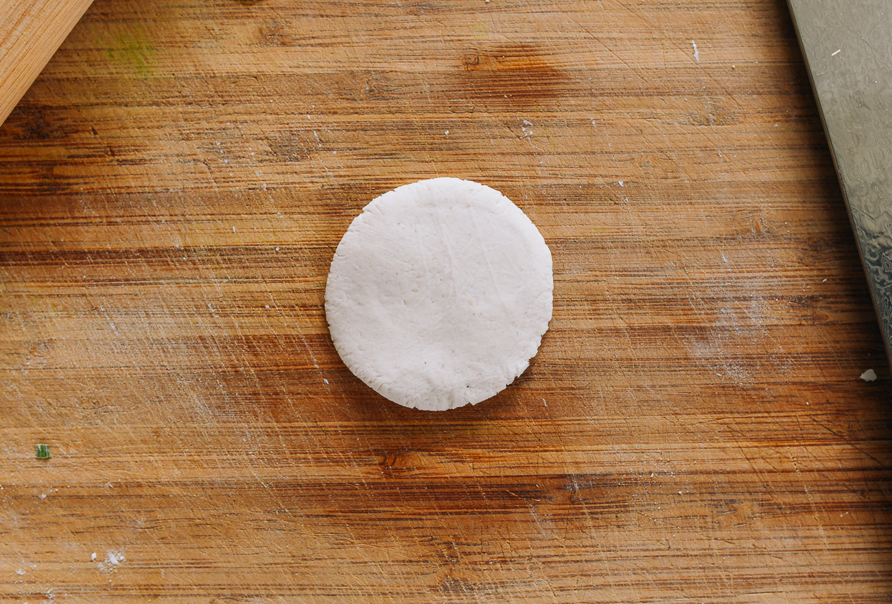 gluten-free dough circle on cutting board