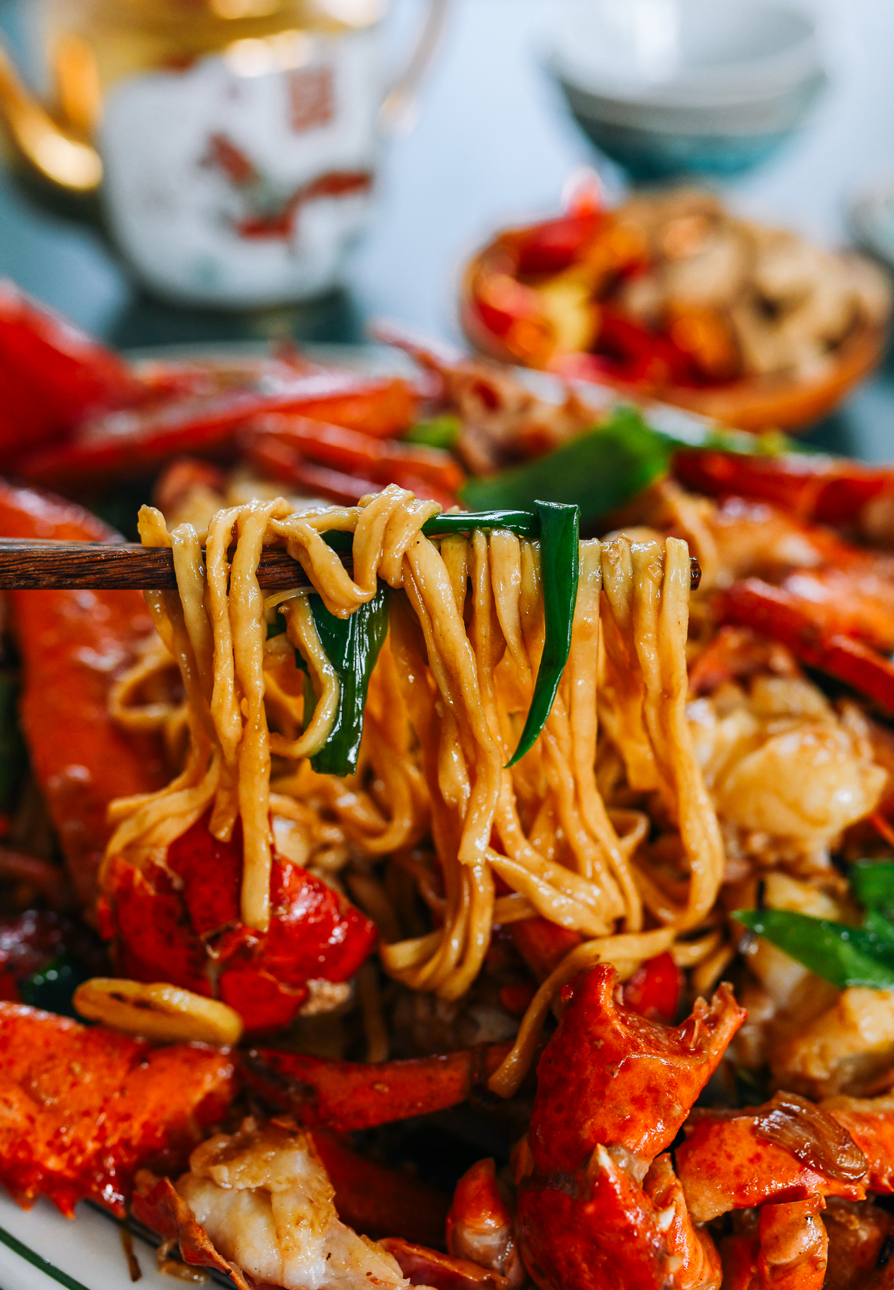 Lobster Yee Mein - picking up noodles with chopsticks
