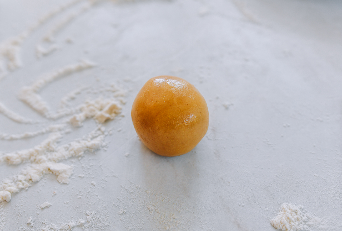 mooncake dough ball on floured surface
