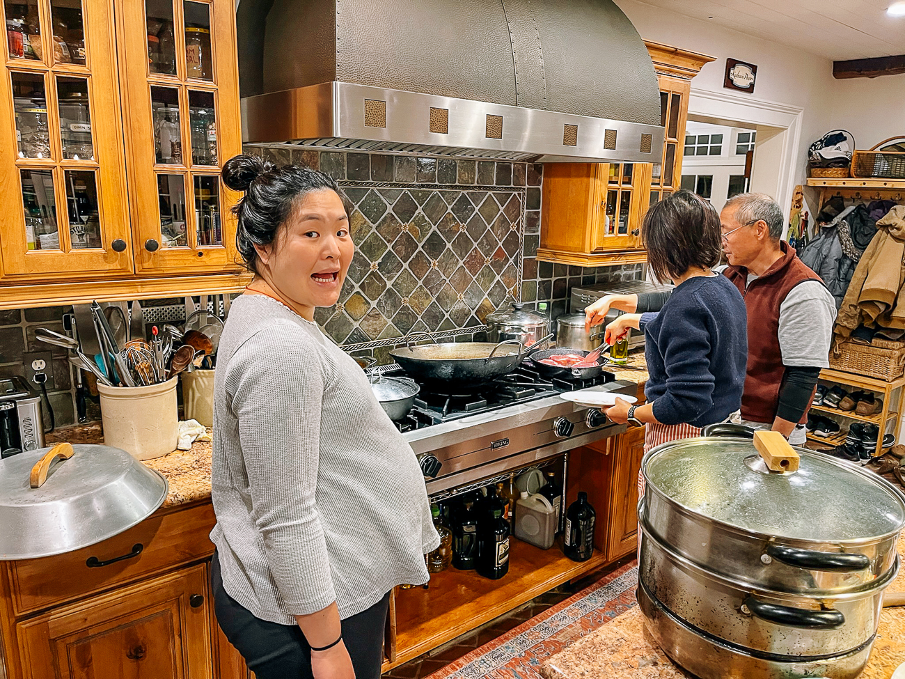 Sarah baby bump with Judy and Bill in kitchen