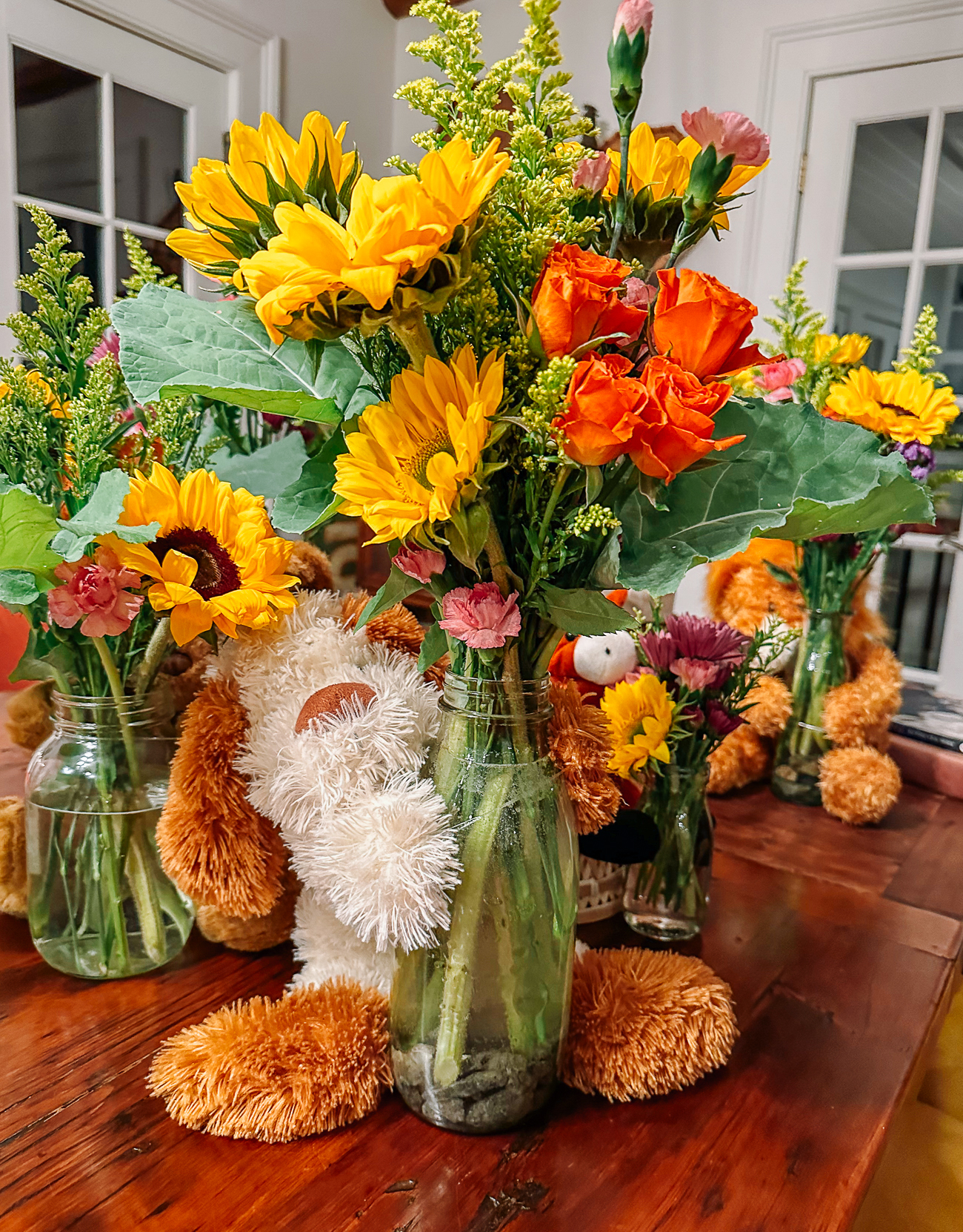 baby shower flowers with stuffed animal