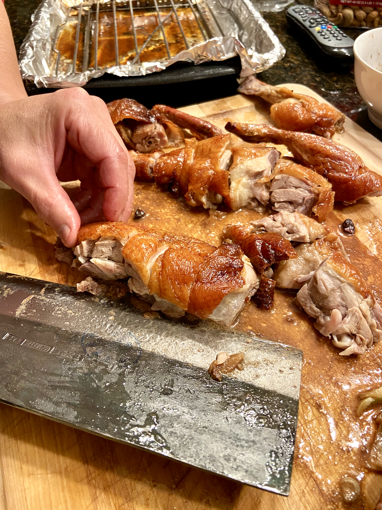 Carving Chinese roast duck recipe on cutting board
