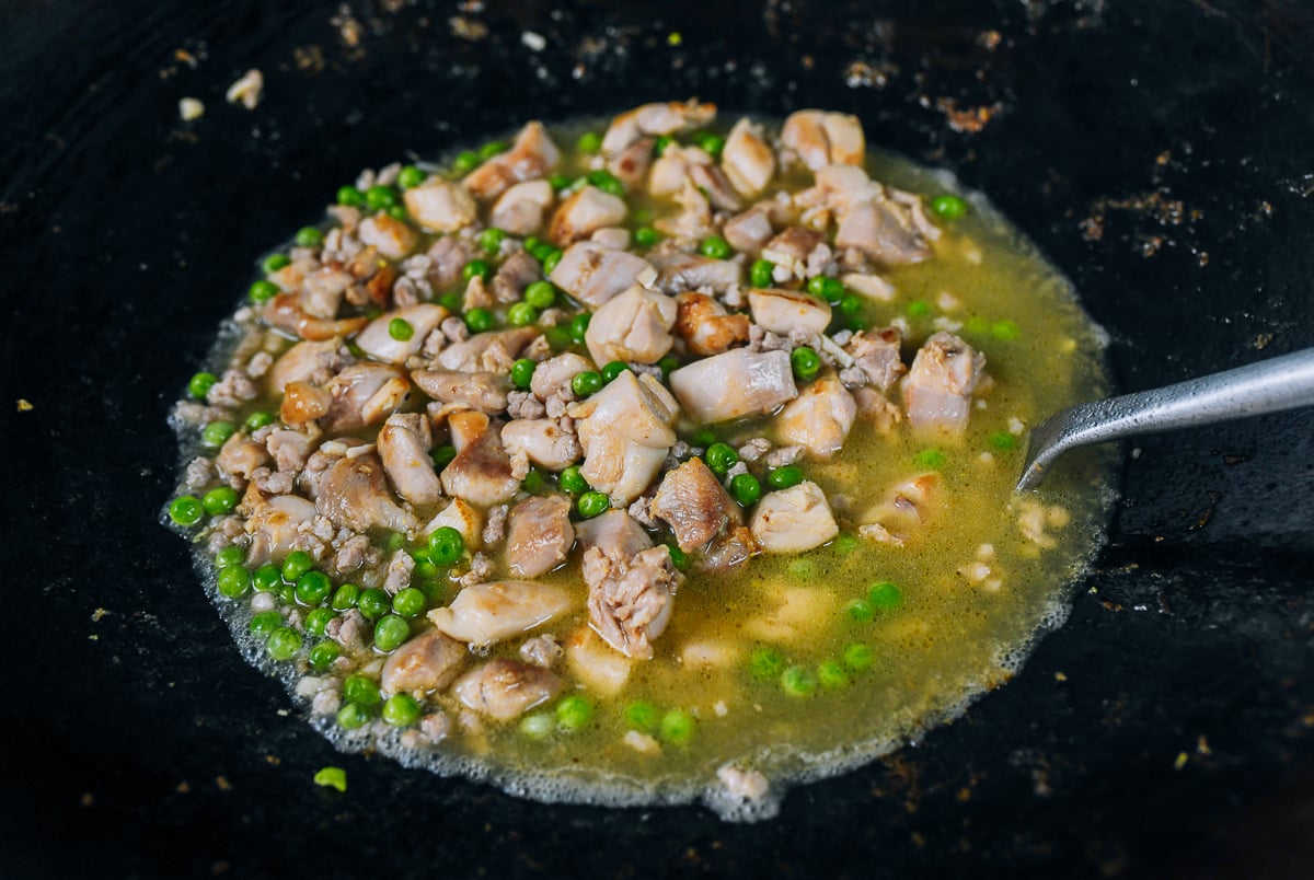 sauce, peas, chicken in wok