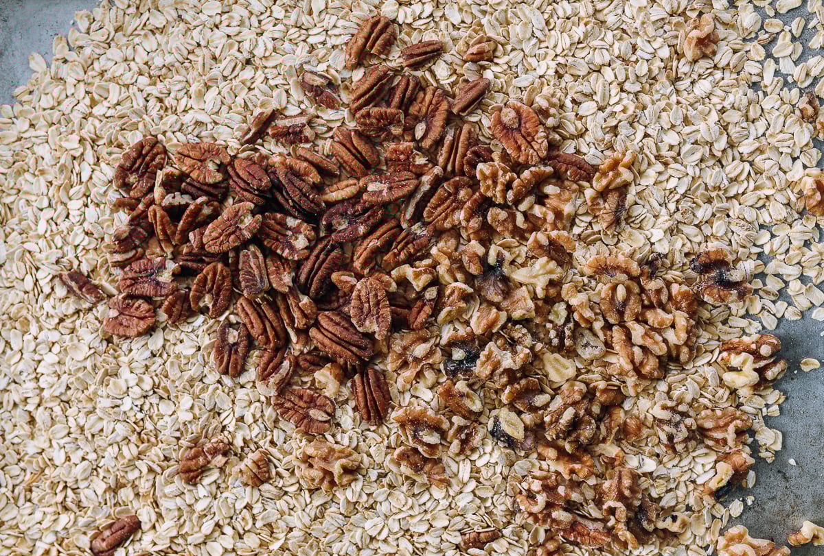 oats, pecans, walnuts on sheet pan