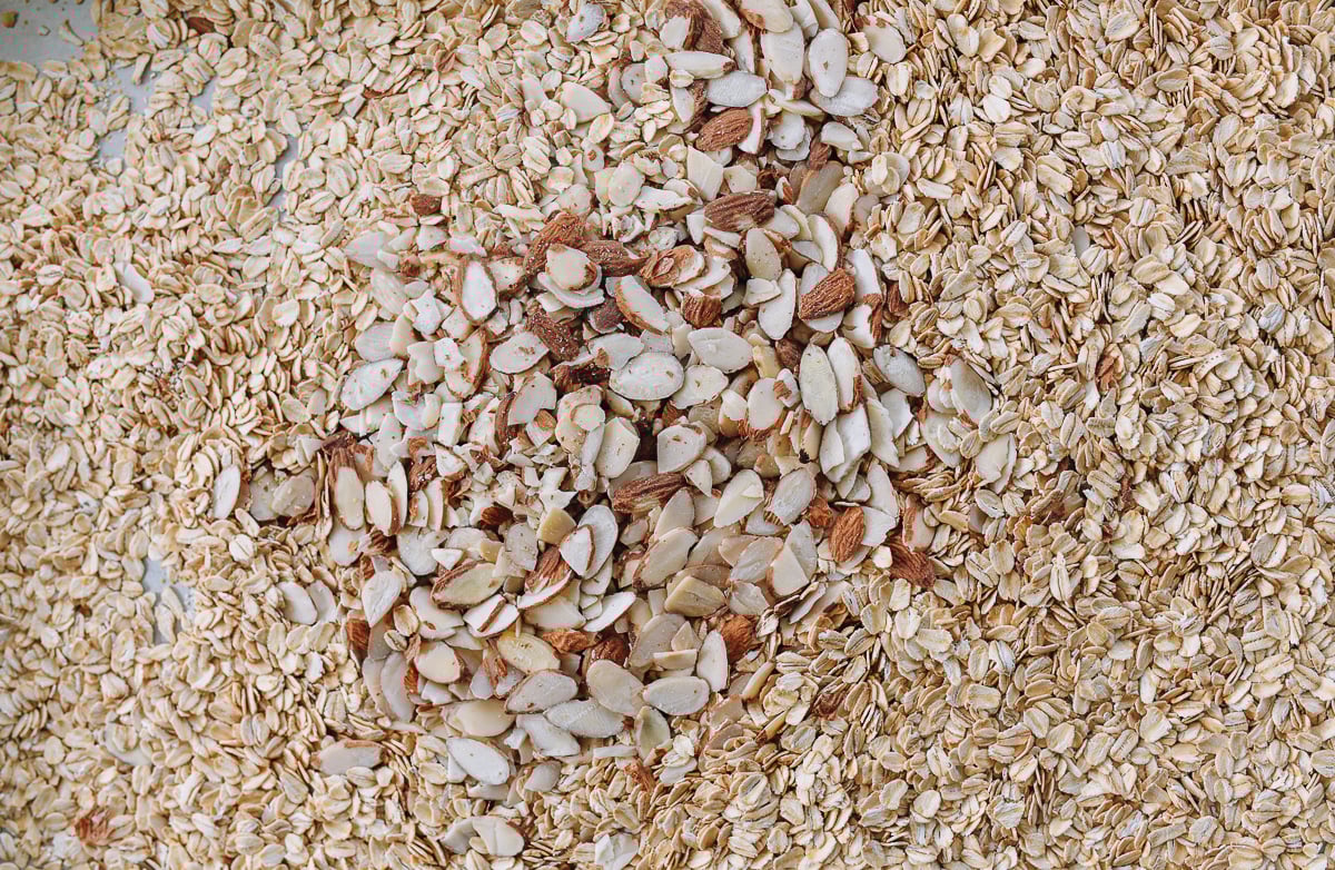 oats and sliced almonds on sheet pan