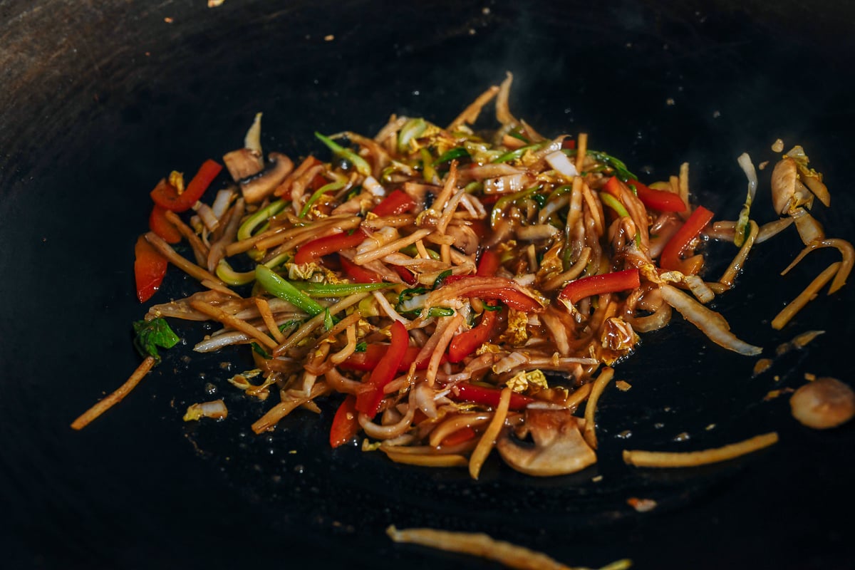 stir-fried julienned vegetables in wok