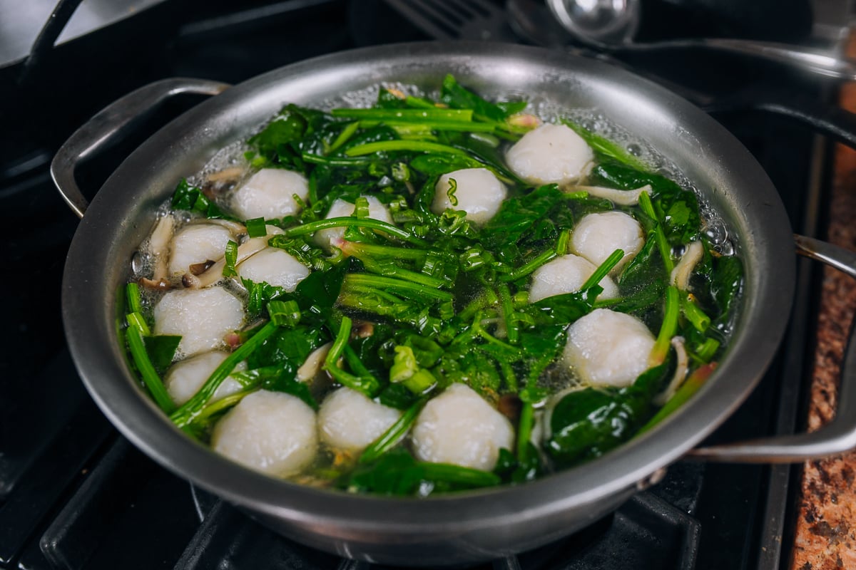 fish balls and spinach in soup