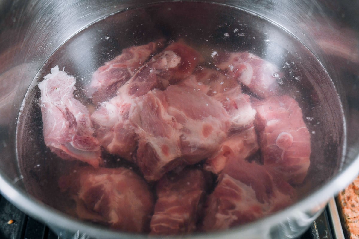 soaked pork bones in pot of water