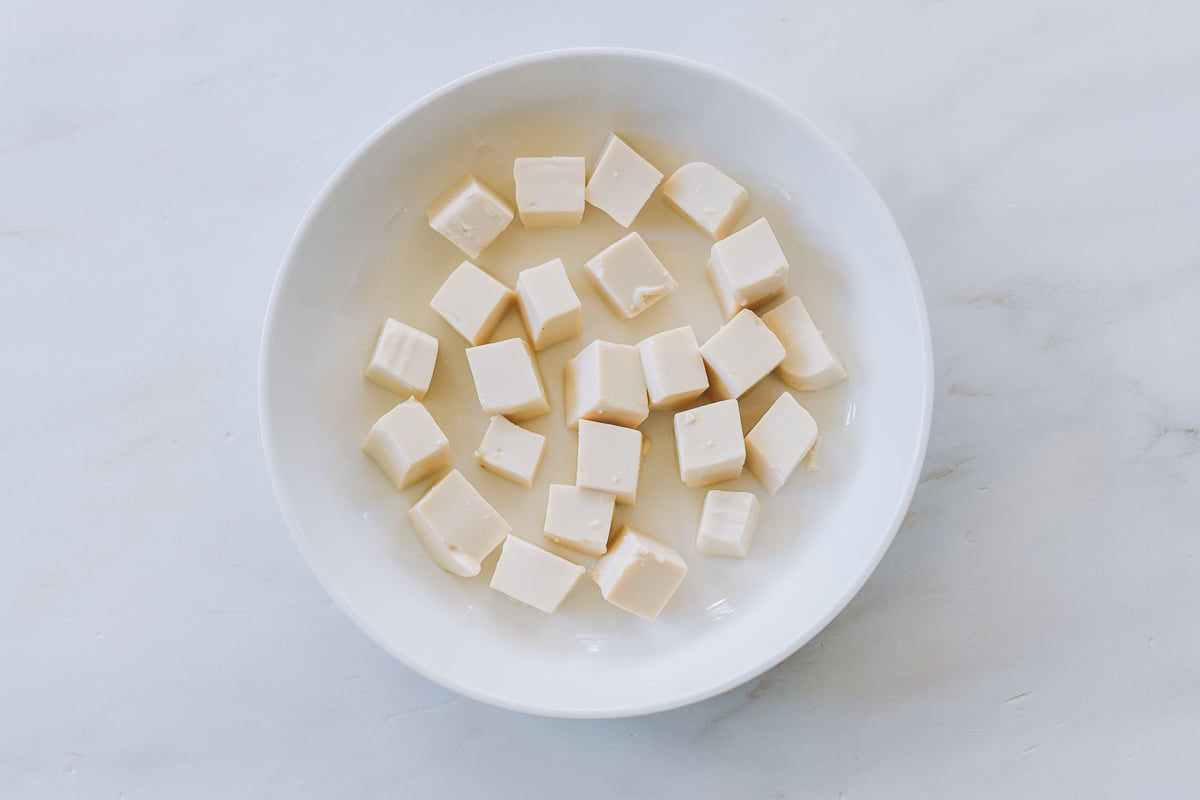 Cubed silken tofu in shallow dish