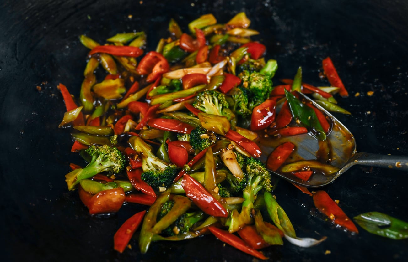 stir-frying vegetables and sauce