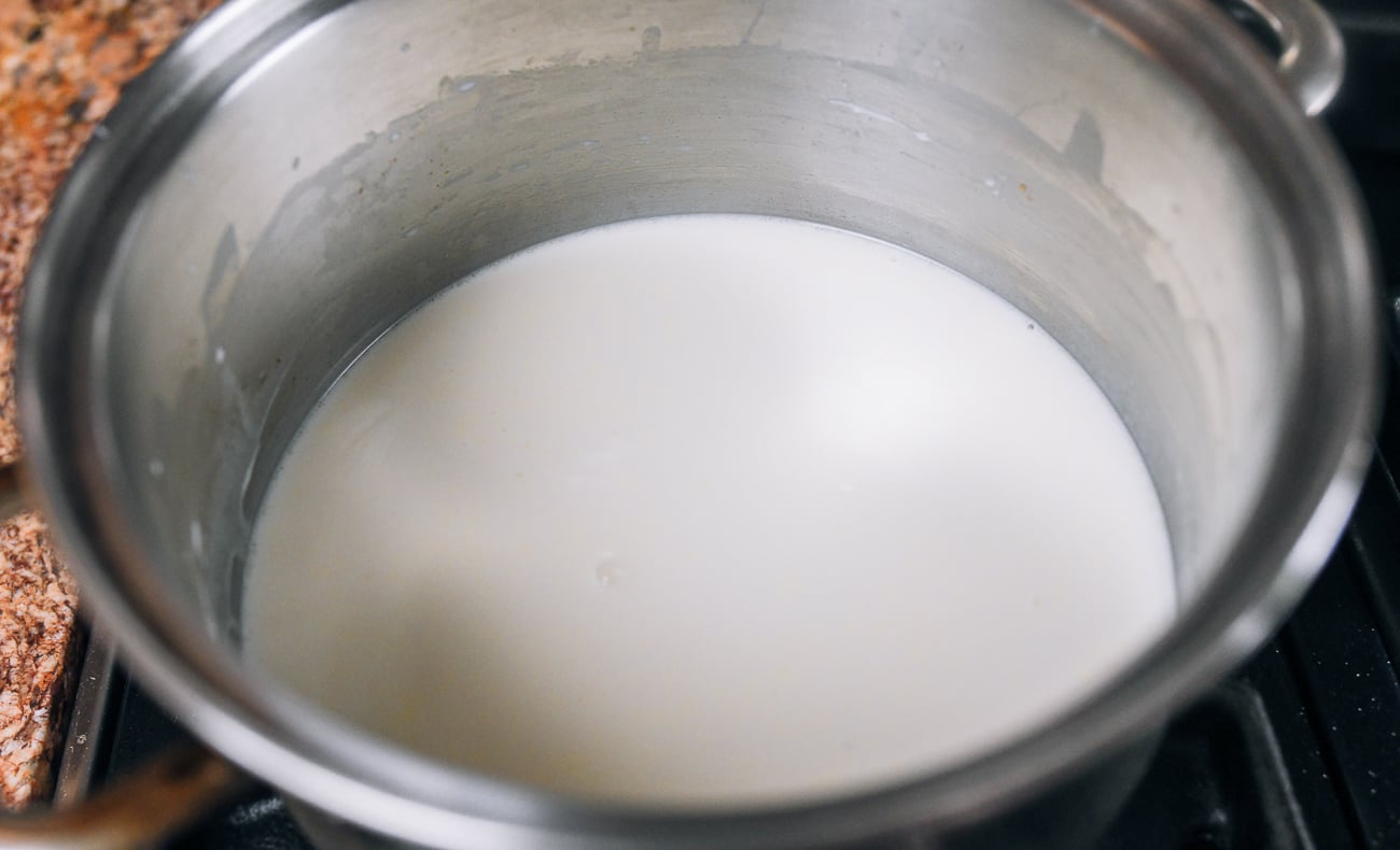 milk pudding mixture in stainless steel pot