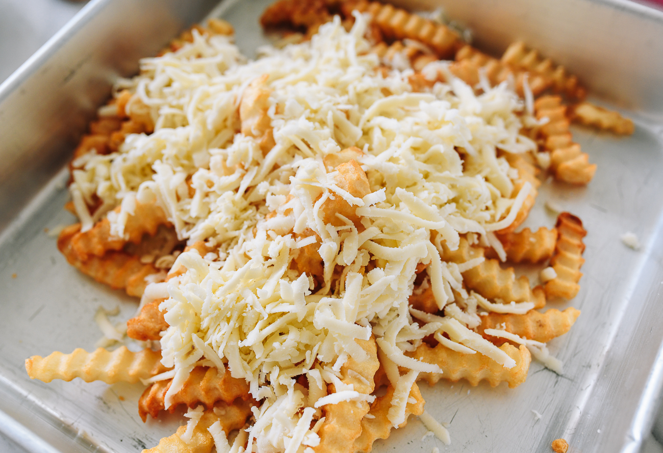 fries with shredded mozzarella on top